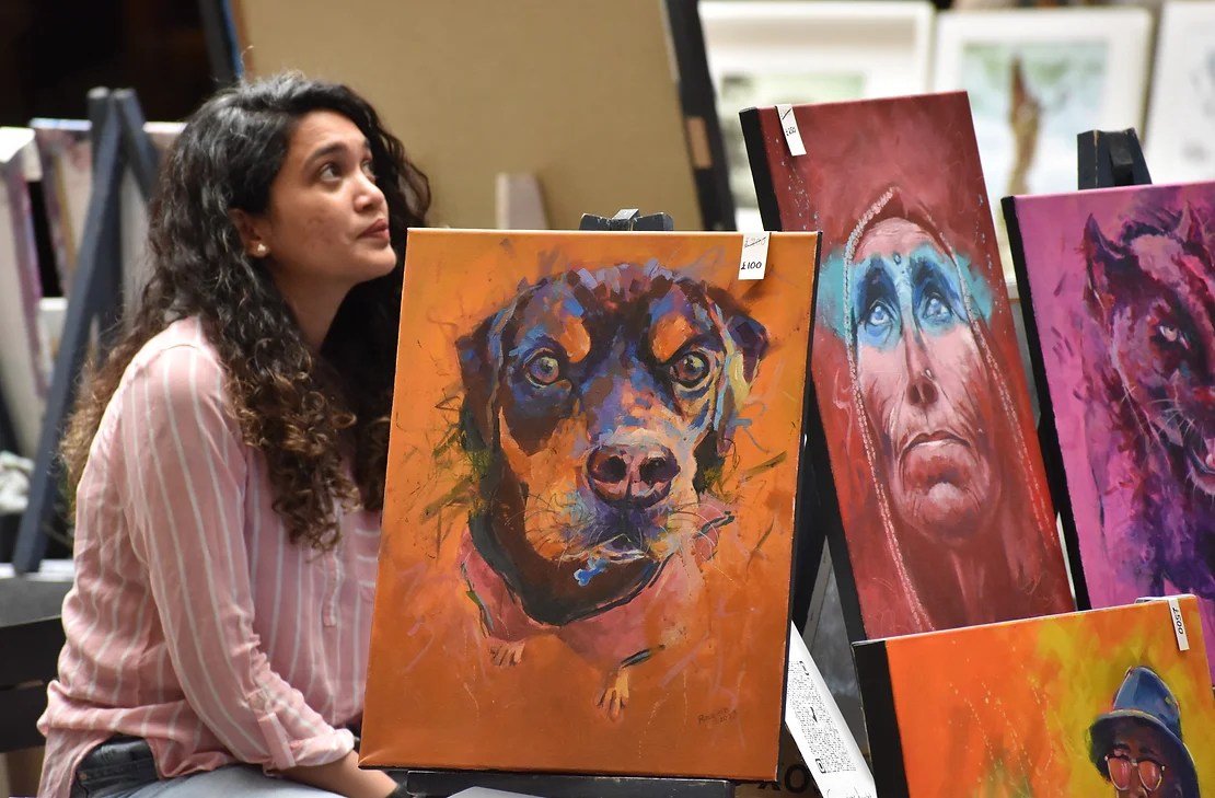 Artist showing her work at Art House Leeds Art Fayre at Leeds Kirkgate Market